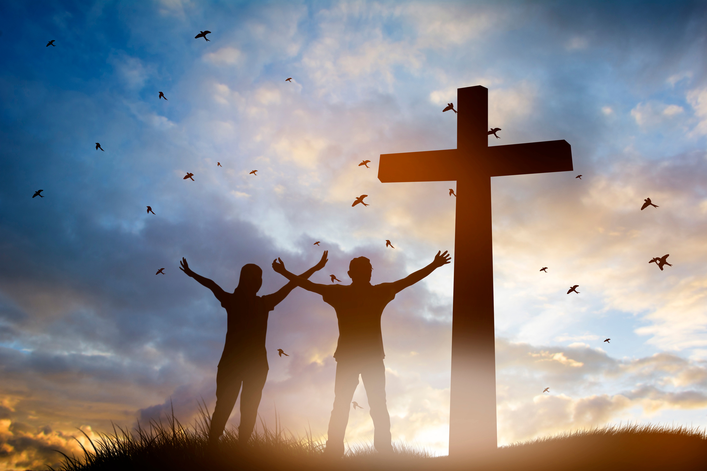 Family worship concept: a family at the Cross of Jesus.